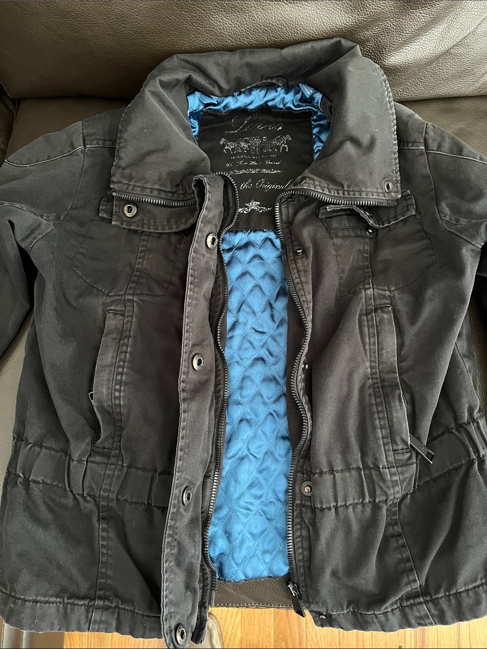 Levi's Black Jean Jacket with Blue Quilted Lining.  Excellent condition.
